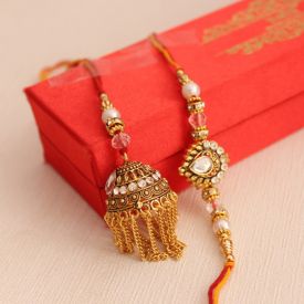 Pearl Rakhi that is crafted with golden strings