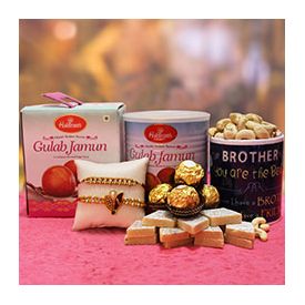 Kaju Katli, Gulab Jamun, Cashews, Ferrero Rocher, printed mug and two beautiful Sandalwood Rakhis