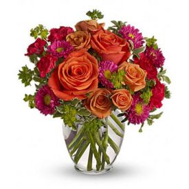 Light orange roses, orange spray roses, and matsumoto asters, hot pink miniature carnations lovely g