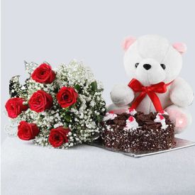 10 Red Roses and Heart Shaped Black Forest Cake with a Teddy Bear