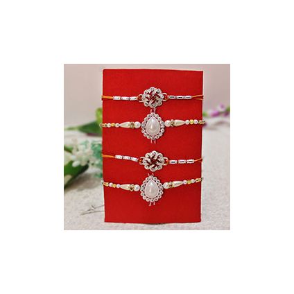 4 Rakhis, 2 Silver Stone Studded Rakhis ,2 Pearl Rakhis